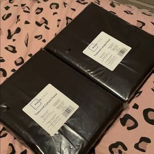 Two brand new black curtains